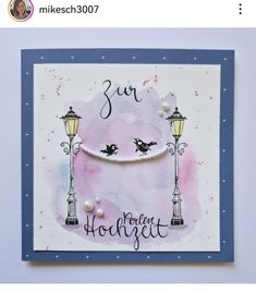 a handmade greeting card with two birds on a street lamp post and the words, sur horsquet