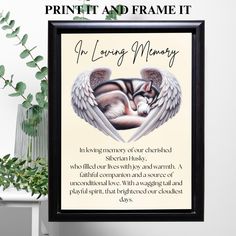 a framed print with an angel's wings and the words in loving memory