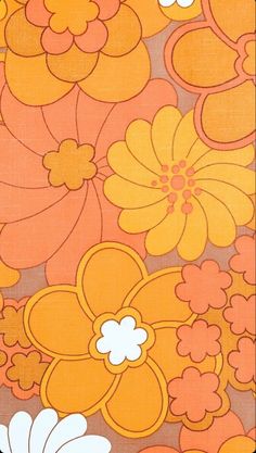 an orange and white flower pattern on fabric