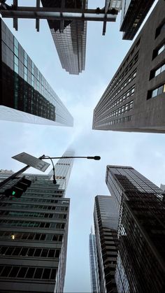 looking up at tall buildings in the city