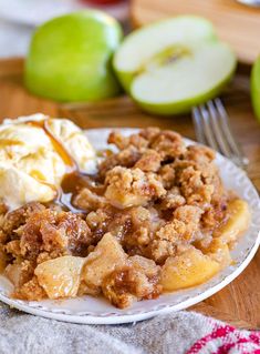 an apple crisp on a plate with ice cream