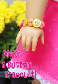 a close up of a doll's hand with buttons on it and the words make a button bracelet