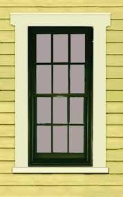 an image of a window that is on the side of a yellow house with white trim