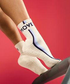 the legs of a person wearing white socks with i love move written on them