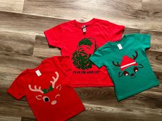 Kids Christmas tshirt in Santa, girl reindeer winking, and boy reindeer. let us know which one you prefer! Santa Girl, Christmas Tshirt, Kids Tops, Christmas Tshirts, Kids Christmas, Reindeer, Gender Neutral, Kids Outfits, Tops & Tees