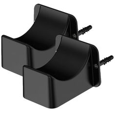 two black plastic holders with screws on each side and one is attached to the wall