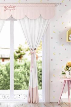 a pink and white room with stars and moon wallpaper on the walls, curtains in front of a window