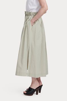 Airy midi skirt featuring deep slip pockets, a broad elastic waistband, and high side slits. Concealed buttons run down the skirt's center. Cut from our signature Organic Crisp Cotton - capable of both structure and ease, ideal for lightweight summer tailoring. 100% Cotton Side slip pockets Side slits Concealed button-front closure Made in USA Spring Maxi Skirt With Pockets For Daywear, Chic Daywear Maxi Skirt With Pockets, Chic Maxi Skirt With Pockets For Daywear, Long Skirt With Pockets For Daywear, Relaxed Fit Midi Skirt For Daywear, Spring Asymmetrical Skirt With Side Slits, Asymmetrical Skirt With Side Slits For Spring, Relaxed Fit Midi Skirt With Lining, Spring Midi Length Gathered Skirt