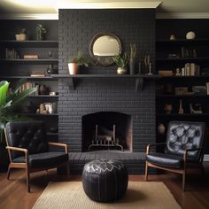 a living room with two chairs and a fire place