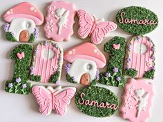 decorated cookies are arranged in the shape of houses