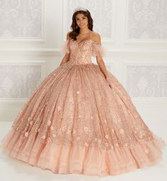 Tulle and glitter tulle ball gown with a sweetheart neckline, beaded bodice, basques waist, corset back, three-dimensional flowers throughout, stone and crystal accents and a detachable off-the shoulder beaded strap detail. Short Cape included. Available without Ruffled Hem as Style PR22144