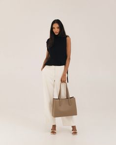 Polished work bag, meet casual weekend tote. Designed from the inside-out with a thoughtful system of interior pockets and card slots, and handcrafted in our supple, soft-yet-structured vegan ultrafiber leather. Fits 13-14” laptops (measured diagonally) with ease, and center divider means you can even carry two safely. Features a structured base that keeps the bag standing upright even when full, comfortable 2cm wide straps that won't dig into your shoulder, and a handy key leash to keep your ke Chic Soft Leather Laptop Bag With Double Handle, Structured Beige Shoulder Bag For Everyday, Workwear Laptop Bag With Removable Pouch And Double Handle, Everyday Structured Beige Shoulder Bag, Taupe Soft Leather Work Bags, Workwear Laptop Bag With Top Handle And Removable Pouch, Top Handle Laptop Bag With Removable Pouch For Work, Structured Soft Leather Bag For Work, Chic Taupe Shoulder Bag For Work