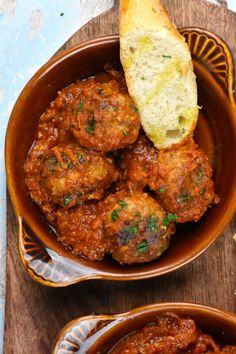 meatballs in tomato sauce with bread on the side