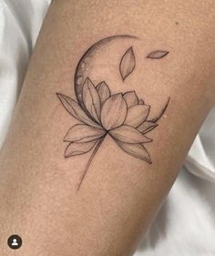 a woman's leg with a lotus flower tattoo on the left side of her thigh