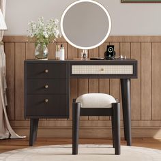 a vanity table with a mirror and stool in front of wooden paneled wallpaper