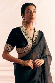 Black silk velvet padded blouse with floral pattern border, applique, thread, bead and sequin embroidered border. Paired with silk organza saree with scalloped cut work hem. - Aza Fashions Black Saree Blouse, Saree Blouses Online, Saree Silk, Beaded Blouse, Black Saree, Organza Saree, Embroidered Applique, Sequins Embroidery, Silk Organza