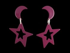 These unique moon and star themed plastic earrings are in that iconic 1980s shade of a deep plum/purple/magenta. They are a post/dangle combo and feel sturdy and smooth while not being heavy. The moon measures approximately 1.25x1 inches and the star measures approximately 2.75x2.5 inches with an overall length of 4 inches. Idea Lab, Deep Plum, Plastic Earrings, Good To See You, Moon And Star, Plum Purple, Moon And Stars, Xmas Gifts, The Star