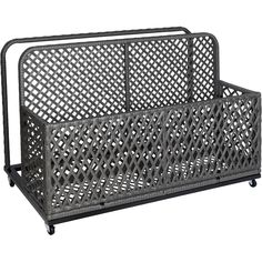 a black metal mail holder with latticed design on the front and back sides, sitting on casteors