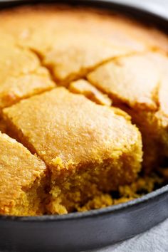 a pan filled with cornbread on top of a table