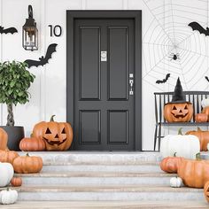 halloween decorations on the front steps of a house