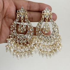 White gold Pearl Kundan chandbali Earrings, White chandbali earrings, Indian pakistani wedding jewelry, bridesmaid gift Indo Western Chand Earring With Gold Plating Product Weight = 25 grams each earring Height = 95 mm || Width = 60 mm Trendy Design Indo Western Earring Arrives in a gift box Color, shades, texture displayed may slightly vary from the actual product due to digital image limitations. We request you to consider these minor variations. Please expect the possibility of some slight imperfections when buying handmade jewelry. If you have any questions, please contact us. Luxury Fusion Style Chandbalis For Wedding, Luxury Wedding Chandbali Pearl Earrings, Luxury Chandbali Earrings For Eid, Luxury White Meenakari Bridal Earrings, Luxury Chandbali Danglers For Anniversary, Luxury Chinon Palazzo Set Chandbali Style, Luxury Pearl Drop Chandbalis For Celebration, Luxury Chandbali Jewelry For Celebration, Luxury Cutdana Chandbali Pearl Necklace