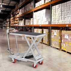 a dolly cart in a warehouse with boxes on the shelves