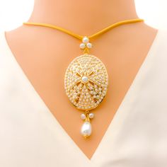 Emanate elegance with this 22k yellow gold pendant set, gracefully weighing 17.5 grams. The prominent oval design is adorned with radiant Pearls, elevating its pristine charm. The pendant, measuring 3.1", pairs harmoniously with the matching 1.8" earrings, creating a cohesive ensemble. Chain not included. PRODUCT DETAILS Gold Purity(karat): 22k Item Weight(grams): 17.5 Item Finish: Yellow Gold Stone: Pearl Pendant Length: 3.1" Matching Earrings: Included Earring Length: 1.8" Earring Post: Screw Luxury 22k Gold Round Pendant Jewelry, Luxury 22k Gold Jewelry With Round Pendant, Gold Pendant Set, Earring Post, Gold Stone, Yellow Gold Pendants, 22k Gold, Pendant Set, Pearl Pendant