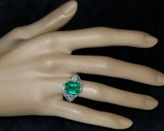 Gorgeous Vintage Diamond & Emerald in Platinum ring circ 1920's center set natural Colombia emerald weight 4.43ct size 11.1x9.3mm GIA cert. Has a nice rich green color ,brilliant clean very lively stones. Side Set two Natural old mine cut Diamonds Weight 0.50ct. Size 4mm SI1 -G lively brilliant, clean white bright stones. Side set small diamonds weight 0.25ct. Ring size 7.5 Resizable This tremendous old vintage ring is in a very good condition. Retail value $18,500 net. Appraisal available Gia Certified Art Deco Emerald Ring, Collectible Art Deco Emerald Ring, Art Deco Emerald Ring With Diamond Accents, Art Deco Collectible Emerald Ring, Art Deco Filigree, Filigree Engagement Ring, Emerald Diamond Ring, Rich Green, 18k Gold Ring