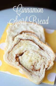 two pieces of bread sitting on top of a yellow napkin