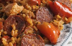 sausage and rice with tomatoes on a plate