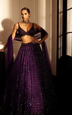 Embrace luxury with the royalty purple crystal embroidered lehenga set featuring an intricately hand-embroidered lehenga and dupatta adorned with sequins and crystal embroidery perfectly paired with a jewelled blouse embellished with crystals. Modern Lehenga Designs Style, Modern Lehenga Designs, Indian Reception Dress, Lehenga Purple, Modern Lehenga, Weddind Dress, Vani Vats, Bride Reception Dresses