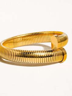 Make a statement with our 18K Wrap Around Bangle Bracelet, a must-have for anyone who values elegance and sophistication. Perfect for adding a touch of luxury to any outfit, this bracelet will wrap around your wrist in a stunning display of beauty and grace. -18K Gold Plating -Stainless Steel -Inner Diameter: 2.75 Thickness: 0. Chic Jubilee Bangle Jewelry, Chic Gold Plated Bangle Bracelet, Luxury Yellow Gold Bracelets, Chic Formal Bangle Jewelry, Chic Jubilee Bangle Bracelet, Chic Gold-tone Bangle Jewelry, Trendy Gold Bangle Bracelet For Formal Occasions, Classic Metal Jewelry For Fashion, Gold Flexible Bangle Bracelet