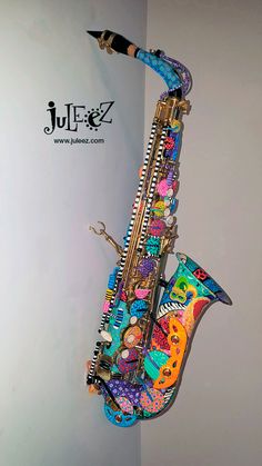 a colorful saxophone is hanging on the wall