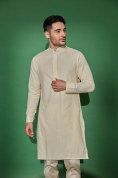 Cream banded collar linen-cotton kurta. Perfect to pair with our vests for a more traditional look Model is 5'9" (168 lbs) and is wearing a size Medium (Last pic shows contrast of the Cream kurta against our Ivory kurta) How to Wear Daytime: pair with the Cream pants for a softer toned look (sold separately) Evening: pair with the Onyx Pants (sold separately) Occassion ideas: wedding ceremony, sangeet, mehndi, Diwali, religious ceremonies Ceremony Outfit, Haldi Ceremony Outfit, Kurta Cotton, Traditional Look, Cream Pants, Beige Shirt, Religious Ceremony, Haldi Ceremony, Cotton Kurta