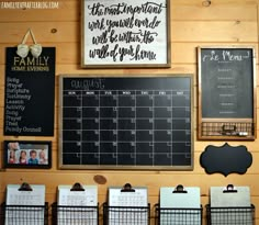 a wall with calendars and chalkboards on it