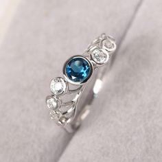 ◆ The ring is handcrafted from sterling silver and decorated with a dazzling 5*5 mm London blue topaz and round shape cz. It is suitable for engagement/anniversary/daily occasion. ◆ Production Description: Main stone Type: Real London Blue Topaz Main Stone Shape: Round Cut Main Stone Size: 5*5 mm(0.56ct) Side stone: Round Shape cz Metal: 925 Sterling silver - Other options available in the drop down menu ◆ Customization: √Free for Add Engraving √Other Metal Type Available √Other Gemstones & Shap Blue Topaz Ring With Bezel Setting For Promise, Blue White Topaz Ring For Promise, Silver Cubic Zirconia Topaz Ring With Birthstone, Elegant Blue Topaz Ring With Bezel Setting, Silver Diamond Ring With Blue Topaz Birthstone, Sapphire Ring With Bezel Setting For Anniversary, Blue Topaz Ring With Bezel Setting, Blue Topaz Ring With Round Cut Bezel Setting, Blue Topaz Rings With Bezel Setting