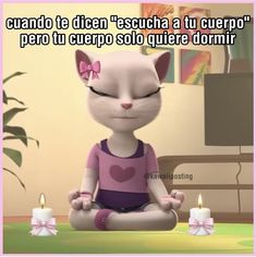 a cartoon cat sitting on top of a table in front of two candles with caption