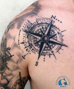 a man with a compass tattoo on his back