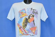 a white t - shirt with an image of a woman on a surfboard and the words free style