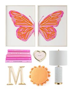 a pink and orange butterfly is on the wall next to some books, a lamp, and two framed pictures