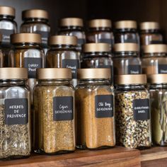 many jars filled with different types of spices