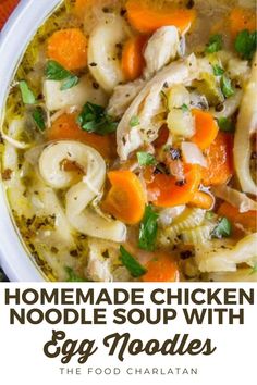 homemade chicken noodle soup with egg noodles in a white bowl on an orange cloth