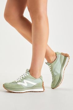 Take to the streets like a style icon in the Steve Madden Campo Sage Green and White Suede Color Block Sneakers! Soft genuine suede leather and mesh fabric (in a sage green and white design) come together to shape these trend-setting sneakers that have an almond-shaped toe upper and a classic lace-up vamp with a pull tab at the tongue. A textured, brown platform sole extends up the heel and completes the look. Shiny logo decal at heel. 1. 25" rubber heel. Cushioned insole. Rubber sole has nonski Sage Green Sneakers, Sage Green Shoes, Sage Green Fashion, Sage Sneakers, Nurse Shoes, Hightop Sneakers, Spring Capsule, Lulu Fashion, Green Sneakers