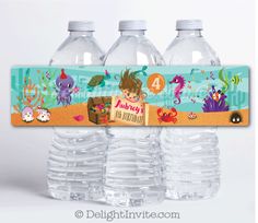 there are four bottles of water with labels on them that say, happy birthday and have an underwater theme