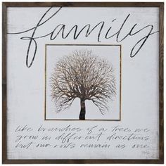 a white framed sign with a tree and the words family written in cursive writing