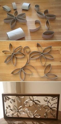 three metal flowers on a wooden surface