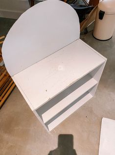 a white desk sitting on top of a hard wood floor