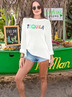 Tequila is always the life of the party! Soft, lightweight and breathable cotton blend top featuring the word "Tequila" knit directly into the center front. A different festive color yarn is used for each letter. The boxy body is knit in a flattering, slouchy shape. Composition: 60% cotton, 40% acrylic Sorel Sneakers, Shape Composition, Sorel Sandals, Denim Jacket With Fur, Drawing Bag, Ooh La La, Life Of The Party, Spirit Wear, Handbag Straps