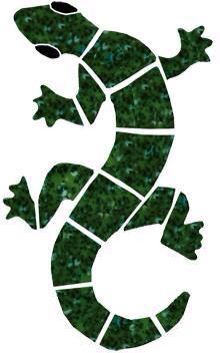 the silhouette of a lizard is made out of green grass