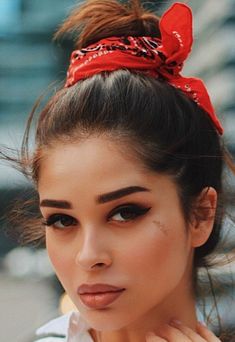 a woman with a red bow in her hair